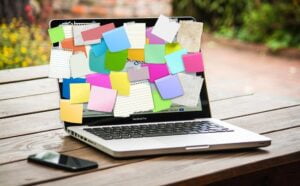 Writers Ideas on Sticky Notes over Laptop